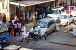 Policeman blocking traffic in a busy street in the center of Victoria.