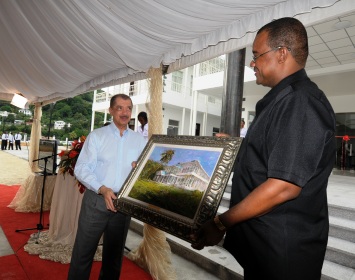 President Michel accepts a painting of the new Assembly building from Speaker Herminie