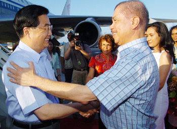 Michel greeting Hu at the International Airport.