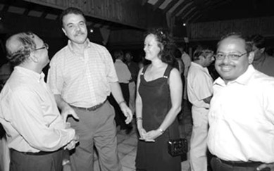 Indian High Commissioner greets P.S. for Foreign Affairs and his wife.