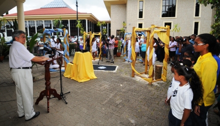 Description: Minister Shamlaye addressing guests at the launch of the exhibition