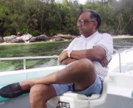 Description: Dinesh on a boat ride, one of his favourite past times