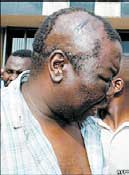 Morgan Tsvangirai with head wounds following assault by police in Zimbabwe.