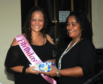 Description: Joenise presents a gift to her daughter Vanessa, who was celebrating her birthday that day