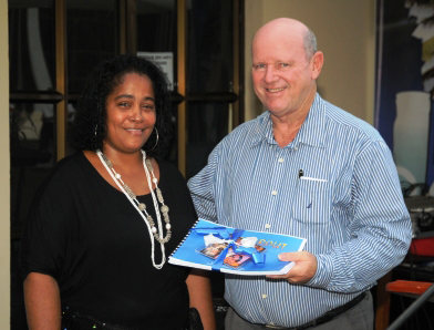 Description: Joenise after she had presented Minister St Ange with a copy of her new CD and profile