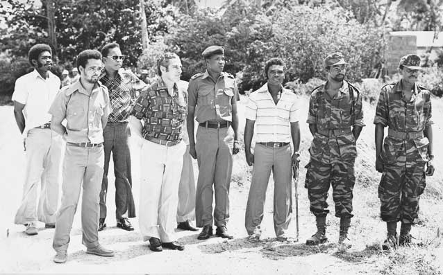 Rene standing nextto a Tanzanian colonel and surrounded by members of the Seychelles Liberation Army which he created.