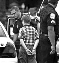 A delinquent child under police custody.