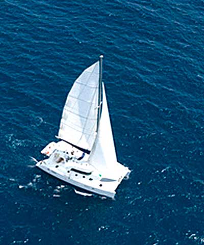 A luxurious catamaran plying the waters of the Seychelles