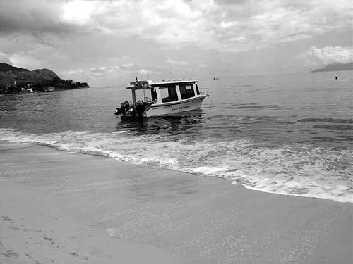 Boat moored at he bay of Beau Vallon