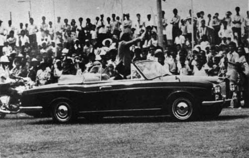 President James Mancham riding in the Rolls Royce into Victoria Stadium.