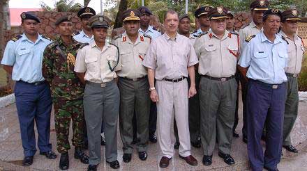 Michel with army officers he promoted.