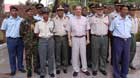 Michel with the army personnel that he promoted.